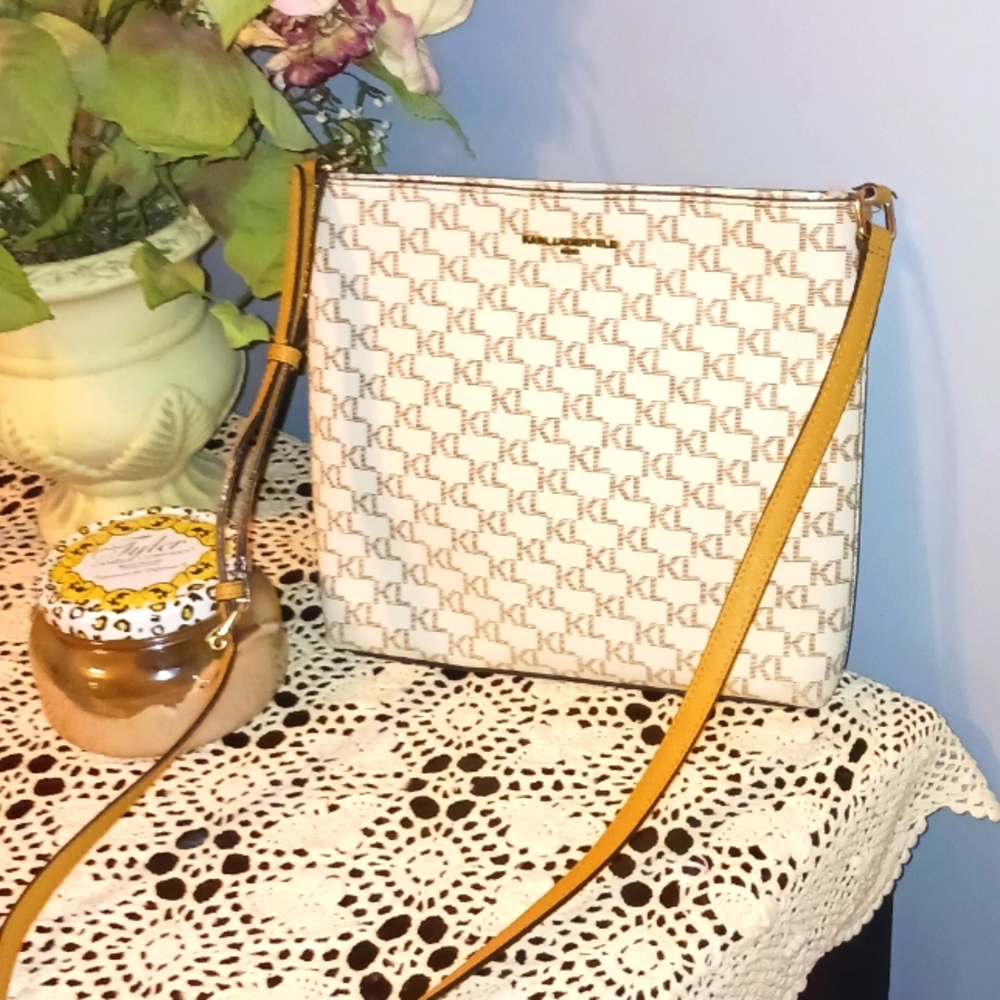 Karl Lagerfeld Women's Cream Colored with Tan Strap Crossbody. Like New!